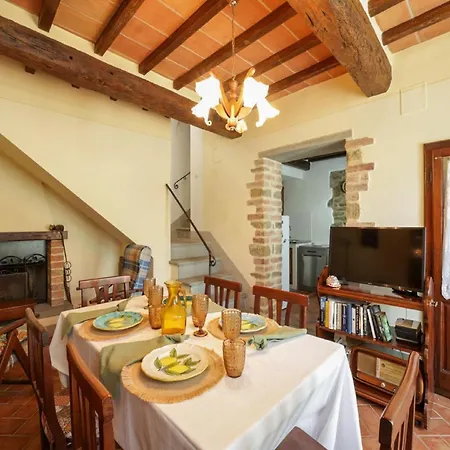 On A Picturesque Hillside, Breathtaking Views Of Cortone